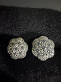 Silver flower moissanite studs — front detail