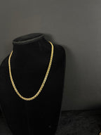 Angled view of the 22-inch Chino Link chain on a black velvet display