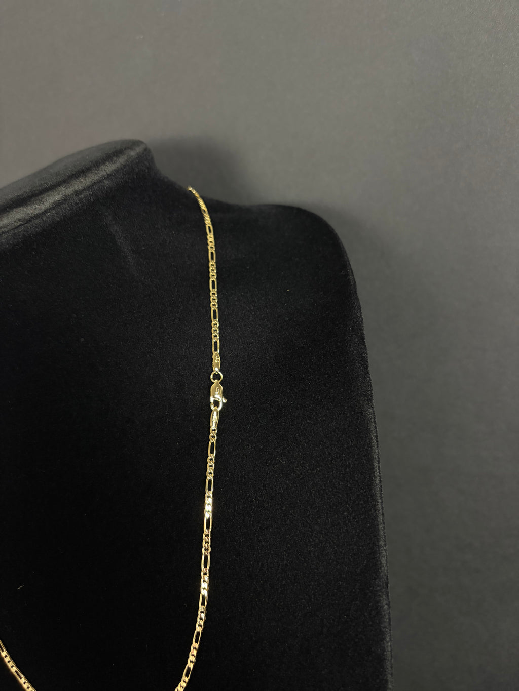 2.4 mm Mini Figaro chain, 22 inches — angled view