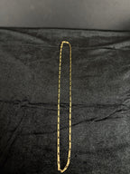 2.4 mm Mini Figaro chain, 22 inches — full chain on dark fabric