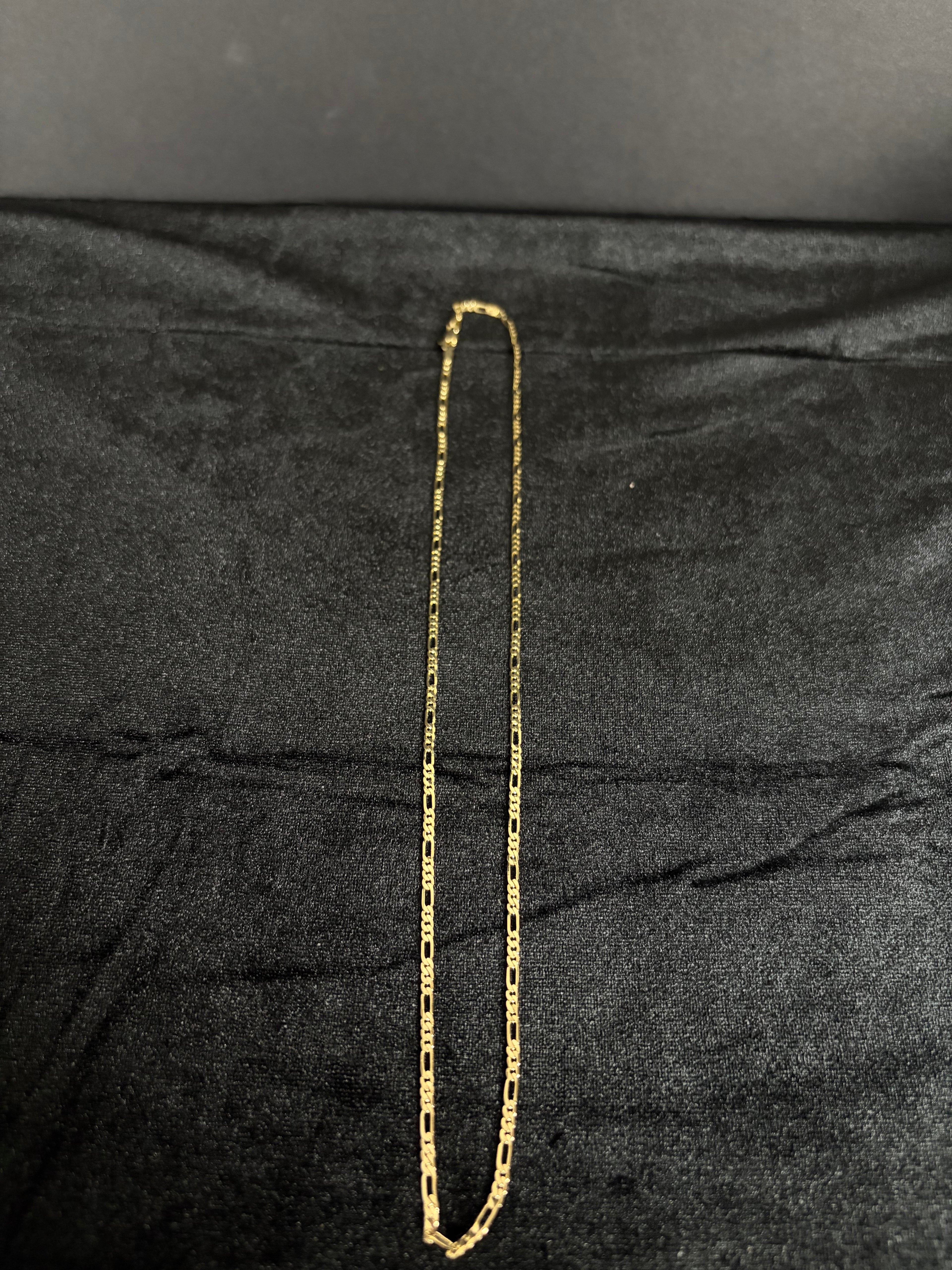2.4 mm Mini Figaro chain, 22 inches — full chain on dark fabric