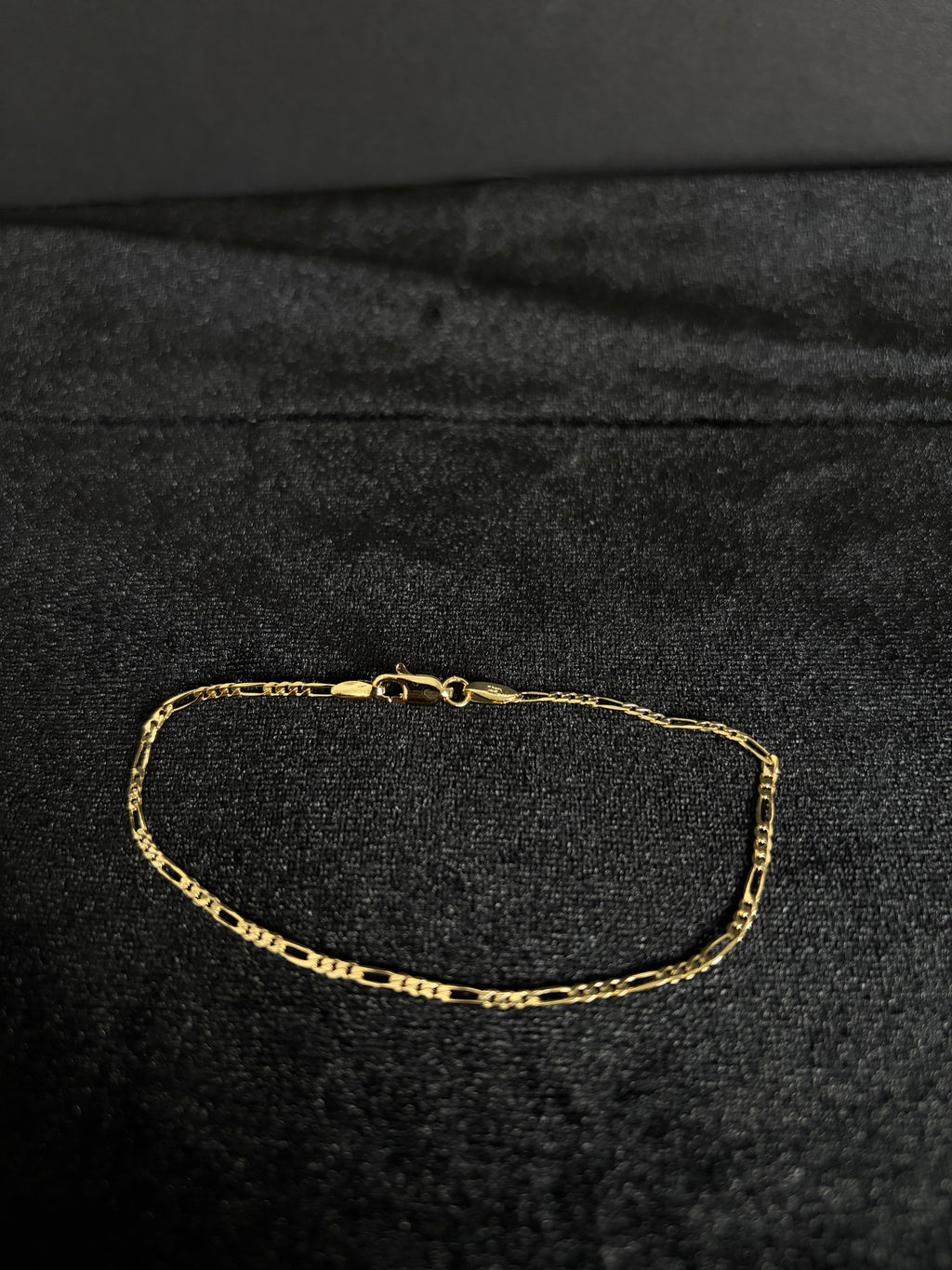 2.4 mm Mini Figaro bracelet, 8 inches — full bracelet and clasp on dark fabric
