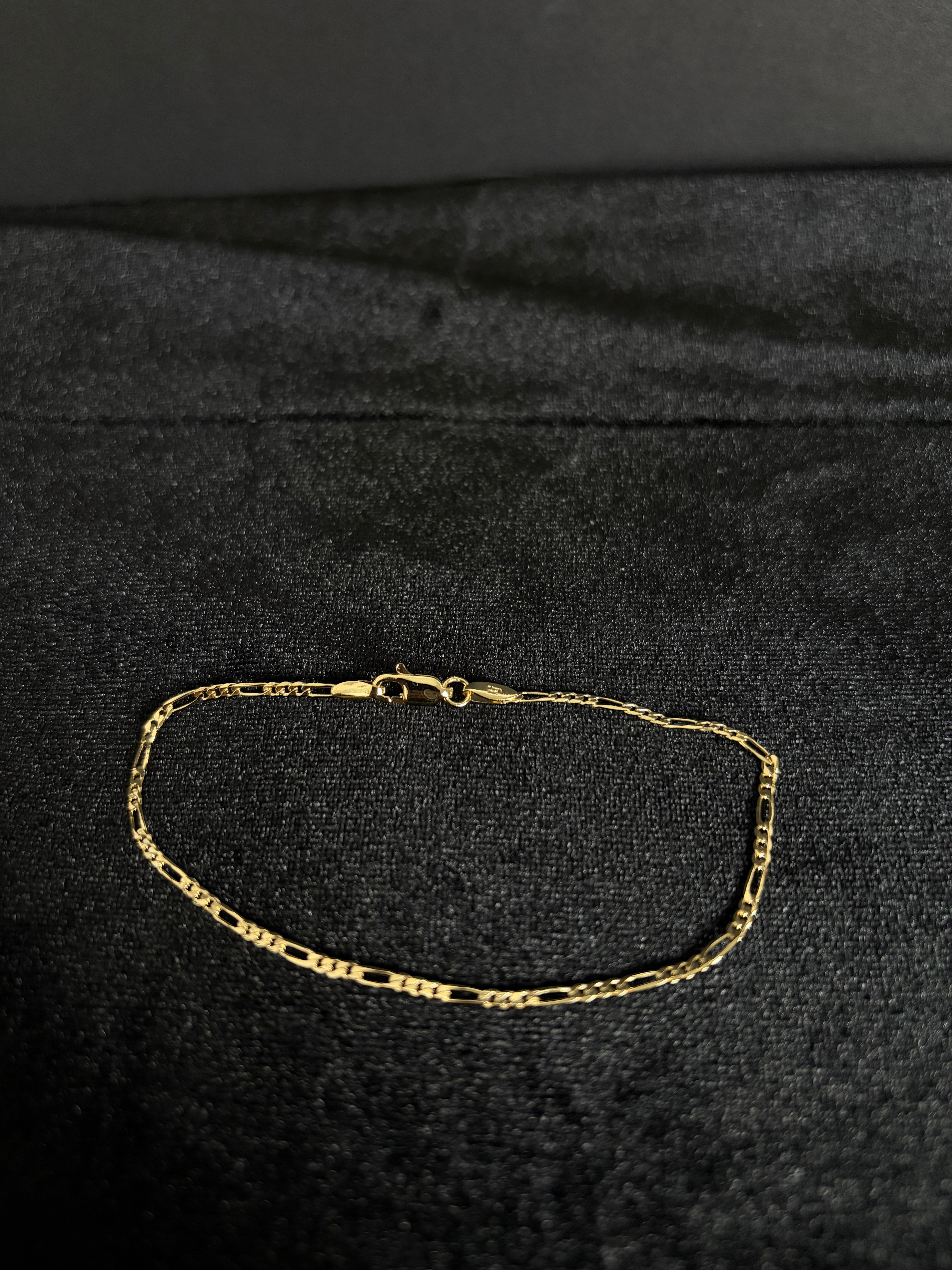 2.4 mm Mini Figaro bracelet, 8 inches — full bracelet and clasp on dark fabric