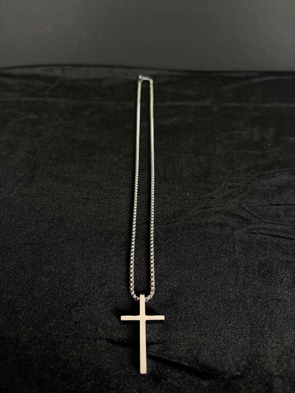 Silver-tone cross necklace — full necklace and cross pendant laid flat