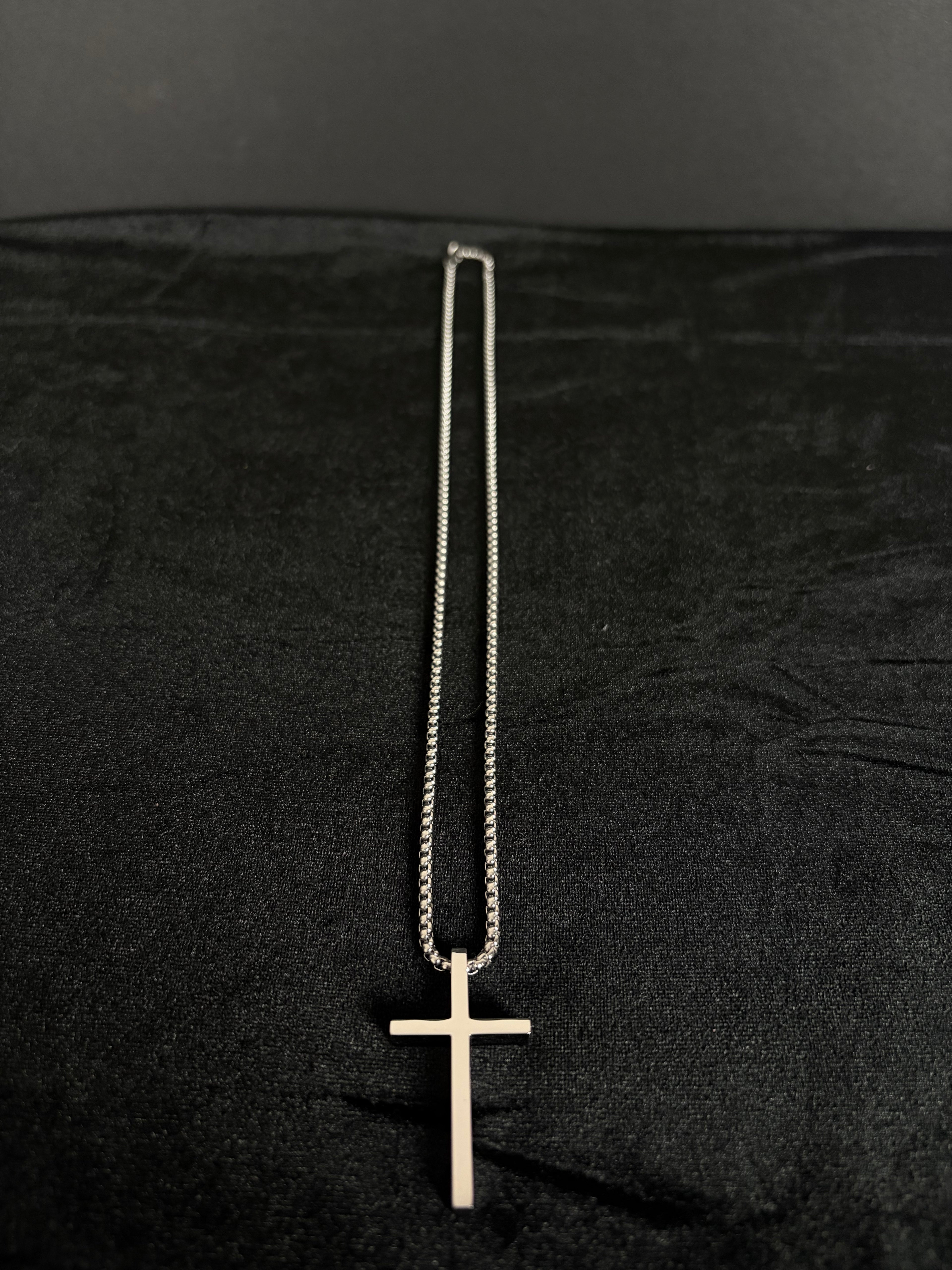 Silver-tone cross necklace — full necklace and cross pendant laid flat